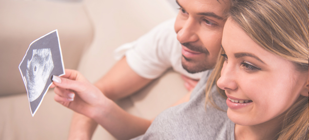 Couple looking at scan picture