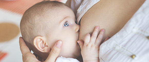 Woman breastfeeding baby